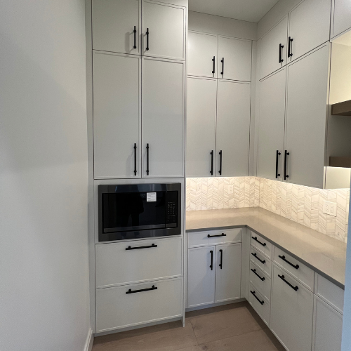 showroom kitchen, white cabinets, microwave